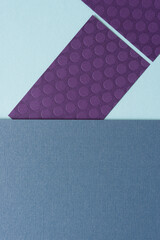 purple paper rectangles on blue