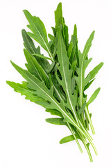 Arugula leaves isolated on white background. Closeup fresh wild rocket leaves on white background top view.
