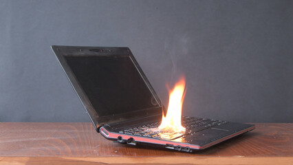 In the room on the table, a laptop caught fire, flames and sparks, a fire in the battery and...