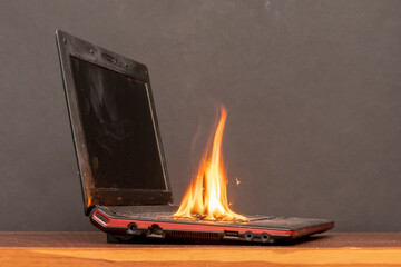 In the room on the table, a laptop caught fire, flames and sparks, a fire in the battery and...