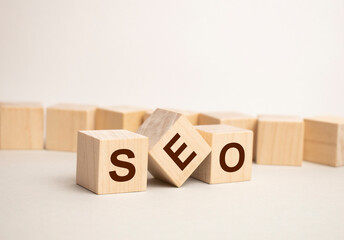 SEO Search Engine Optimization text wooden cube blocks on table background. Idea, Vision, Strategy, Analysis, Keyword and Content concept