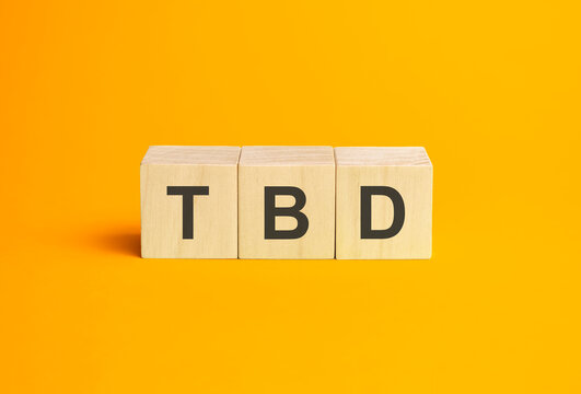 tbd, questions and answers on wooden cubes. Concept