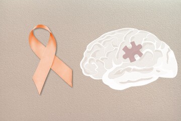 World Multiple Sclerosis Day. Orange awareness ribbon and brain symbol on a background.