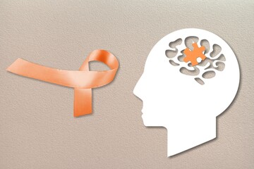 World Multiple Sclerosis Day. Orange awareness ribbon and brain symbol on a background.
