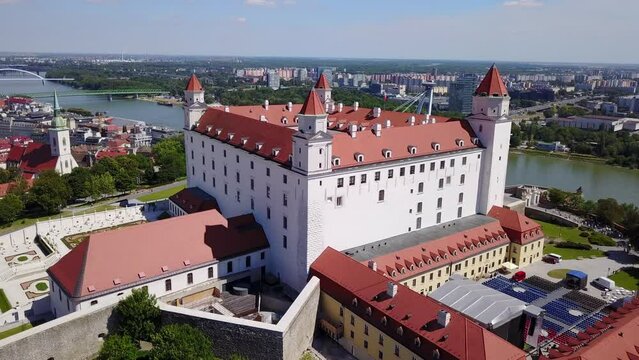 Cinematic 4K aerial drone orbiting footage of the Bratislava Castle with its elaborate garden in the Slovakian capital, by the Danube river