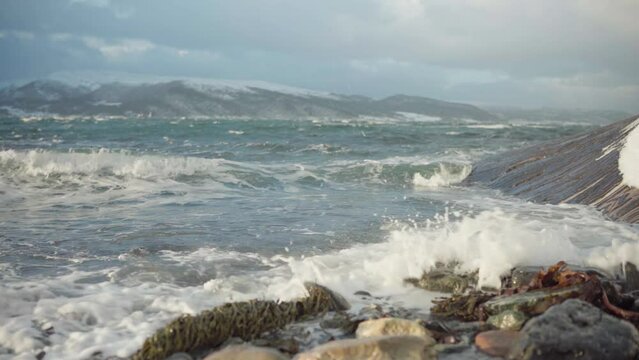 Waves Splashing On The Rocks In Norway. close up