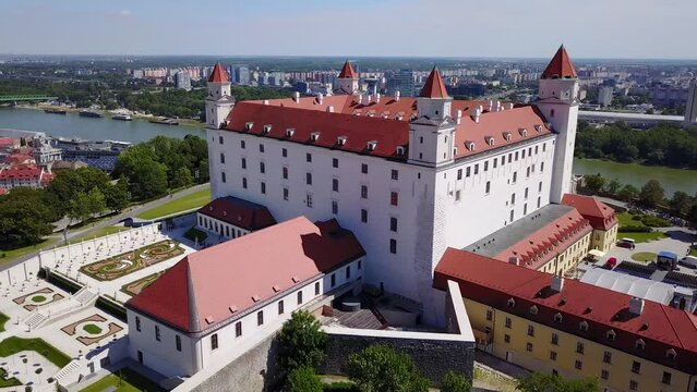 Cinematic 4K aerial drone footage of the renovated Bratislava Castle with its ornate garden in the Slovakian capital, by the Danube river