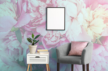 Stylish interior of room with armchair and beautiful peony flowers on wall - Powered by Adobe
