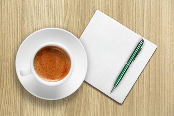 2022 predictions concept, a napkin with a cup of coffee, business and financial trends