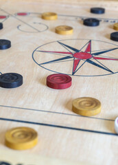 Obraz na płótnie Canvas Carrom is a tabletop game of South Asian origin. Carrom is very commonly played by families, including children, and at social functions.