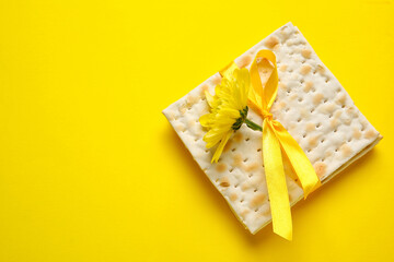 Jewish flatbread with flower on color background