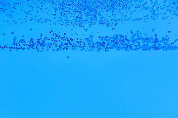 Clear water with air bubbles on blue background