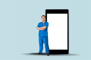 Telemedicine. Young Happy Male Doctor Coming Out Big Cell Phone Screen,