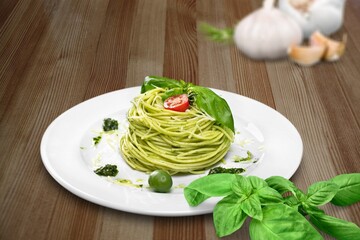 Classic italian pasta pesto with pound garlic, basil leaves, hard parmesan cheese