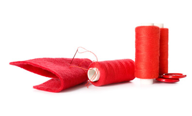 Sewing threads with needle and buttons on white background