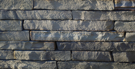 Corses of a stacked sandstone wall 