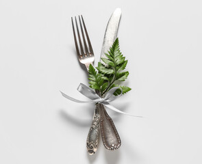 Stylish cutlery on white background