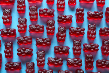 Sweet jelly bears on blue background