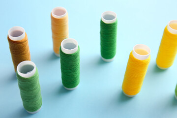 Thread spools on blue background