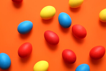 Multicolored Easter eggs on color background