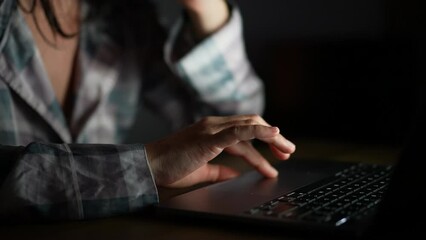 Person hand browsing internet using laptop close-up hand