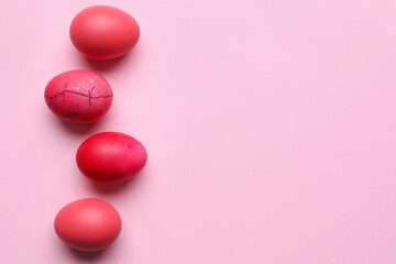 Bright Easter eggs on pink background