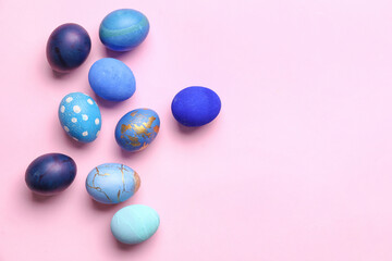Many beautiful Easter eggs on pink background