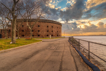 Historic brick fort Castle Williams on Governors Island guarding the Hudson river in New York with...