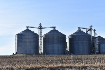 Grain Bins in a Farm Field