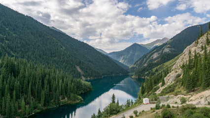 Naklejka na ściany i meble Beautiful deep lake in a mountain valley