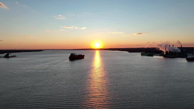 Aerial View of Sunset on Delaware River with Cargo Ship