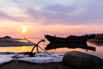 Wooden fishing boats on the coast in the evening