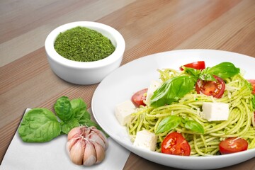 Classic italian pasta pesto with pound garlic, basil leaves, hard parmesan cheese