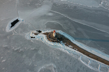 Sea Lighthouse on the Tokarevskaya Koshka rock spit, in winter.