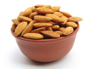 Almonds in a bowl on white background 