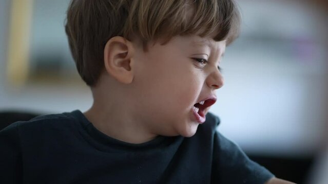 Upset little boy yelling angry child screaming