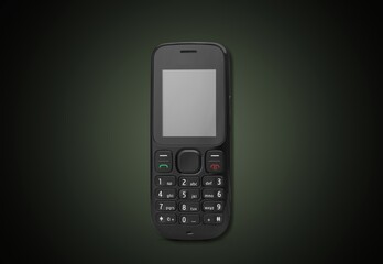 Old retro mobile phone on dark background