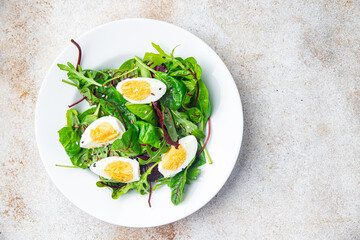 easter salad egg green leaves mix fresh portion dietary healthy meal food snack on the table copy space food background rustic top view keto or paleo diet veggie vegetarian food no meat