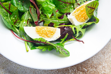 easter salad egg green leaves mix fresh portion dietary healthy meal food snack on the table copy space food background rustic top view keto or paleo diet veggie vegetarian food no meat