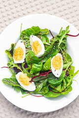 easter salad egg green leaves mix fresh portion dietary healthy meal food snack on the table copy space food background rustic top view keto or paleo diet veggie vegetarian food no meat