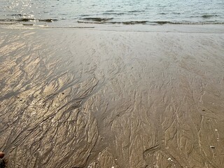 Textured on sand at the beach.