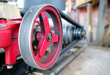 Close up shot of driven pulley of an electric motor water pump