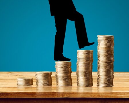Change return on investment, growing savings or wage income concept. Person is going from coins