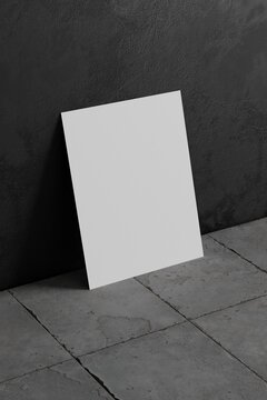 3d white poster mockup on the ground against black concrete wall. 3d illustration.
