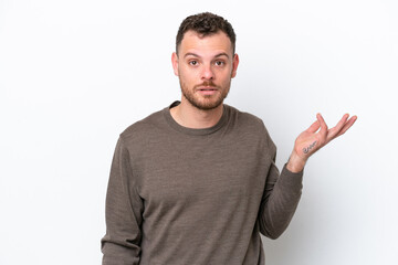 Young Brazilian man isolated on white background making doubts gesture