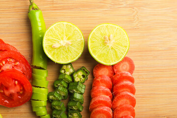 Helthy food concept : Raw vegetable slices on wooden board