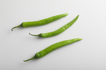 Fresh green chili on white background.
