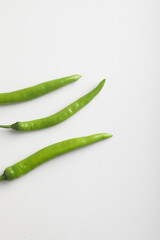 Fresh green chili on white background.