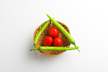 Fresh Green chilli and tomatos on white background.