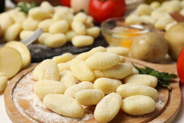 Concept of cooking with raw potato gnocchi, close up